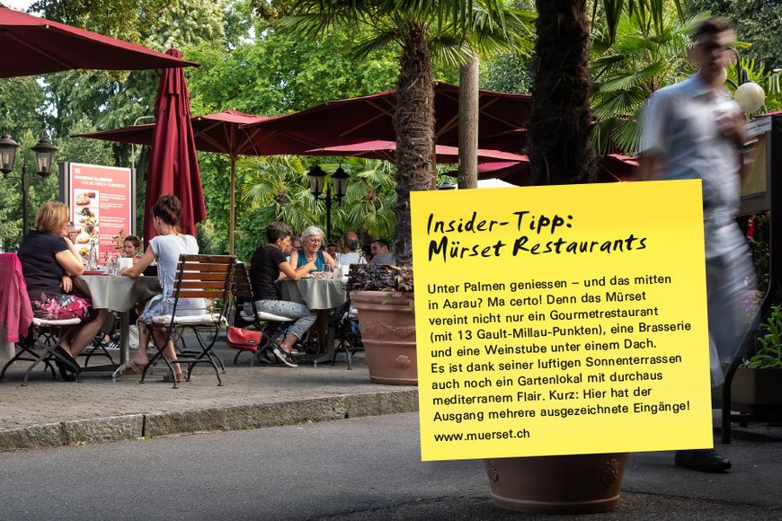 Unter Palmen geniessen – und das mitten in Aarau? Ma certo! Denn das Mürset vereint nicht nur ein Gourmetrestaurant (mit 13 Gault-Millau-Punkten), eine Brasserie und eine Weinstube unter einem Dach. Es ist dank seiner luftigen Sonnenterrassen auch noch ein Gartenlokal mit durchaus mediterranem Flair. Kurz: Hier hat der Ausgang mehrere ausgezeichnete Eingänge!